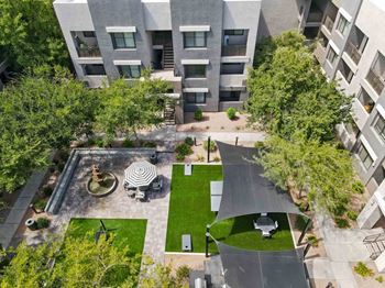 an aerial view of an apartment complex with a courtyard